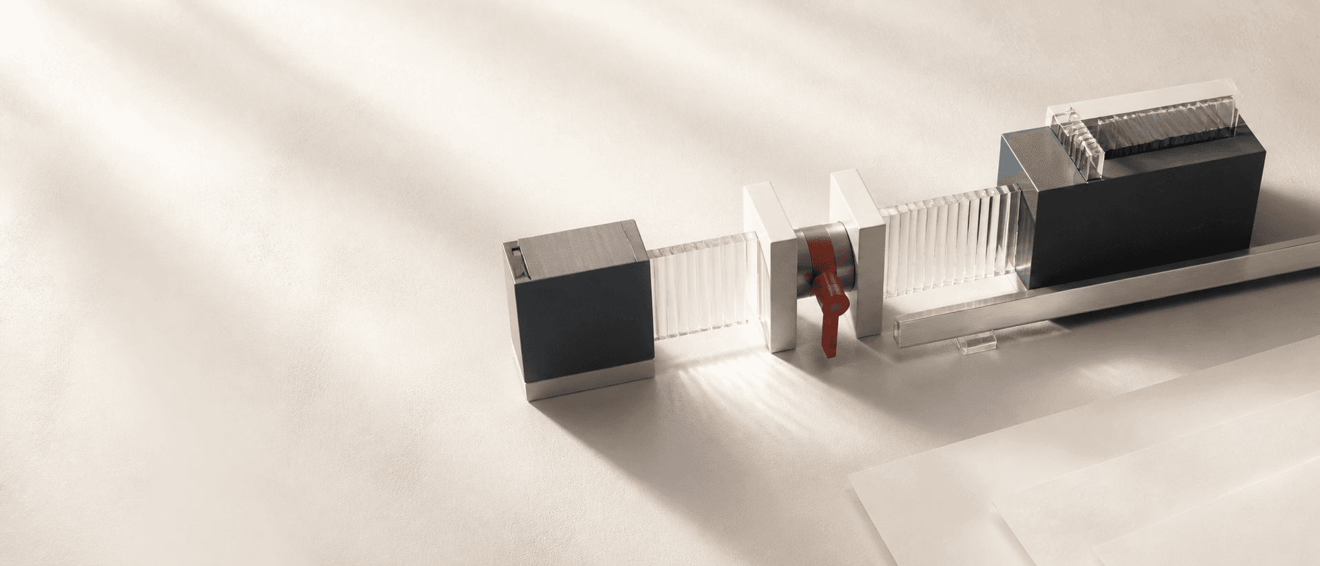 Graphite blocks linked by ribbed glass with a red response control