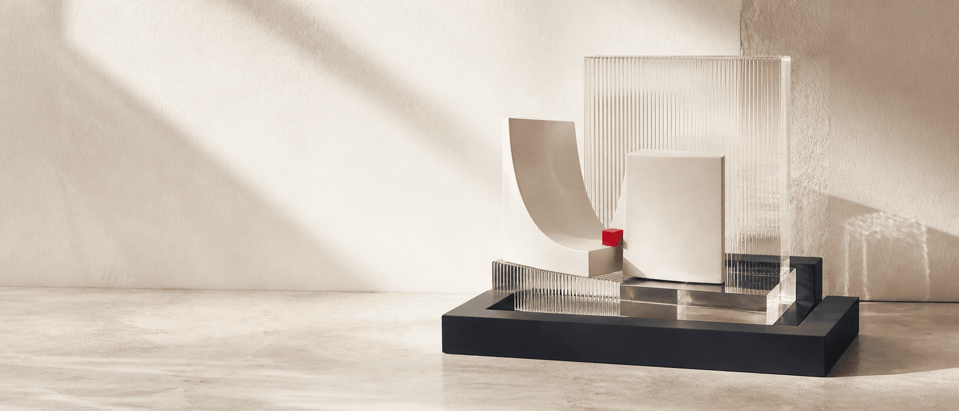 Interlocking ivory forms and clear architectural layers anchored by a graphite frame and a small carmine keystone.